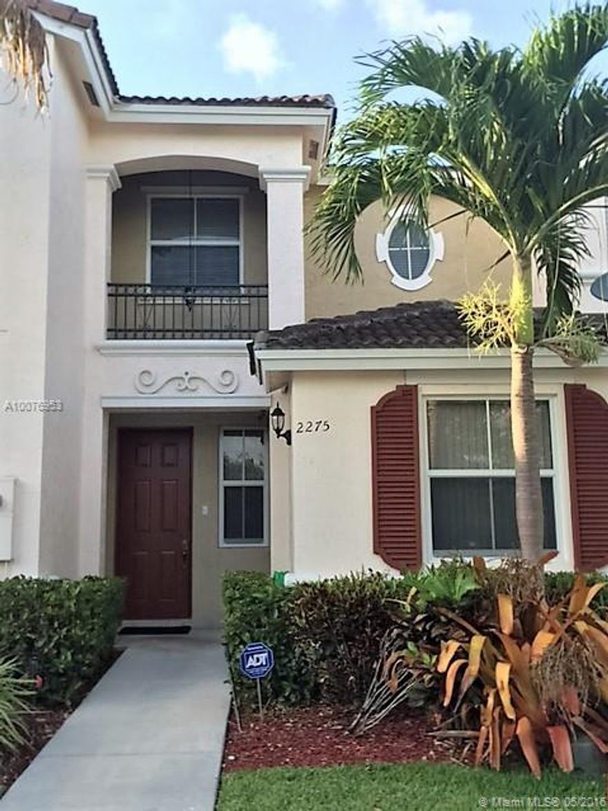 This beautiful, spacious, well maintained 3/3 townhome is move in ready! It features one bedroom downstairs with a full bathroom. Tile floors through out the home, carpeted stairs. Impact doors and windows.  Kitchen has stainless steel appliances and wood cabinets. Fenced in patio with separate storage room. Plenty of closet space and washer dryer inside. Amenities include pool, clubhouse, kids play ground and gym.  Low association fees. Bring your pickiest buyers!