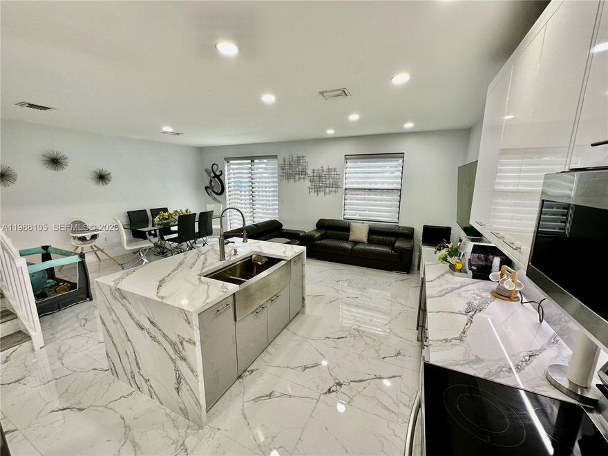 Welcome to your dream home in Silver Palm! This stunning, fully renovated townhome offers 3 spacious bedrooms, 2 1/2 luxurious bathrooms, and gorgeous porcelain floors. Cook in style with quartz countertops and premium high end appliances.  LOW HOA. Don’t miss out on this perfect blend of luxury and convenience—schedule your tour today!