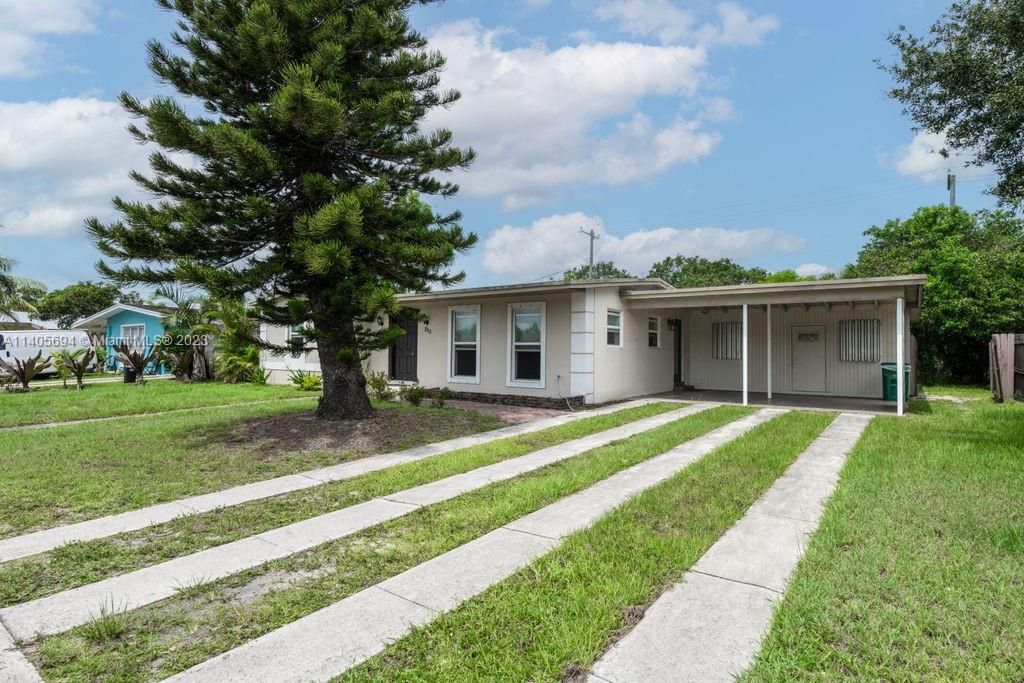 Photo of 250 SW Airoso Blvd, Port Saint Lucie, FL 34983 (MLS # A11405694)