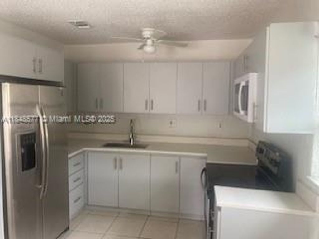 Photo of 2561 NW 14th Ct, Fort Lauderdale, FL 33311 (MLS # A11848577)