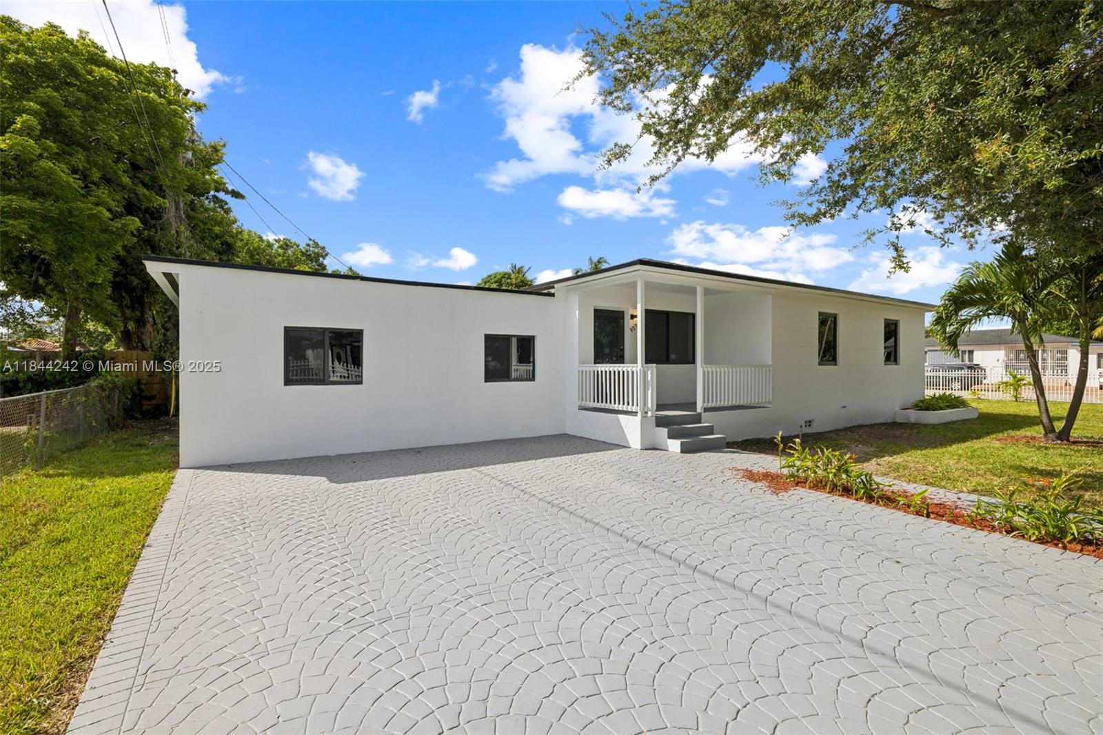 NO HOA! COMPLETELY REMODELED Gated home with 4 bedrooms and 2 full baths with an office that you can easily make a 5th bedroom. Beautiful Large Corner Lot. Brand New Roof, AC, Floors/baseboards and Hurricane Impact Windows and Doors with a modern kitchen with stainless steel appliances. Square footage of property is bigger than what tax roll says.