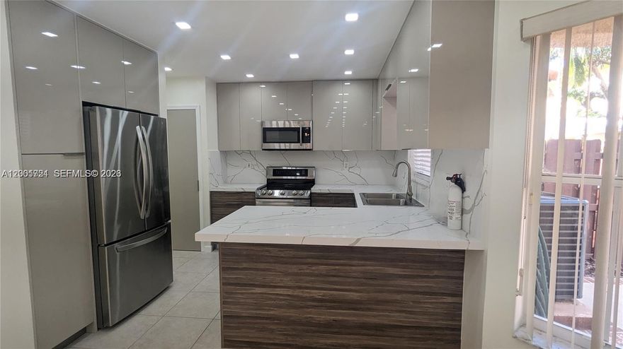 Welcome to this stunning, substantially remodeled townhouse that perfectly blends style and comfort! This spacious **4-bedroom, 2.5-bathroom** residence features an open layout designed for modern living, complete with a private garage and a charming **fenced backyard**—the ultimate setting for hosting friends and family.

Nestled within a **pet-friendly, gated community**, residents enjoy premium amenities including a refreshing pool and a playground. The location is unbeatable: centrally situated with rapid access to **I-595, I-75, and the Turnpike**, making airport commutes a breeze. Enjoy the convenience of being within walking distance to shopping and top-rated schools. This South Florida gem offers the luxury and lifestyle you’ve been searching for. **Schedule your tour today—it won't last!**