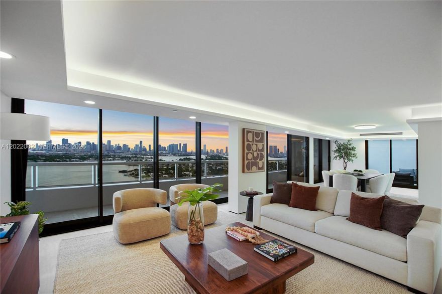 A rare opportunity, this penthouse on Belle Isle, just delivered after a architect-permitted , studs-out renovation, increasing the living area to over 2300 sqft(1). The interior reads as a sky loft: walls reimagined into one continuous great room that flows past full-height impact glass to a chef's kitchen anchored by a calacatta-veined waterfall island. Continuous large-format tile flooring, beneath cove-lit ceilings, an integrated wine bar, designer fixtures and smart-lighting throughout.
Unobstructed, panoramic views of the entire Miami skyline and Biscayne Bay reach into every principal room, then wrap onto an oversized entertaining terrace. Combined with the infinitely long balcony, this top-floor unit has more than 850 SF of outdoor space. Three bedrooms (or two plus a private den or office), three full baths and two garage-parking spots.
Full-service at Nine Island Condos: private marina, enormous pool deck(2), spa, gym, yoga studio, restaurant, valet, doorman. Steps to Sunset Harbour, The Standard, Lincoln Road. 

(1)Updated square footage on record with the city. To be updated soon.
(2)Pool/Spa plans have been approved and final construction is to commence soon.