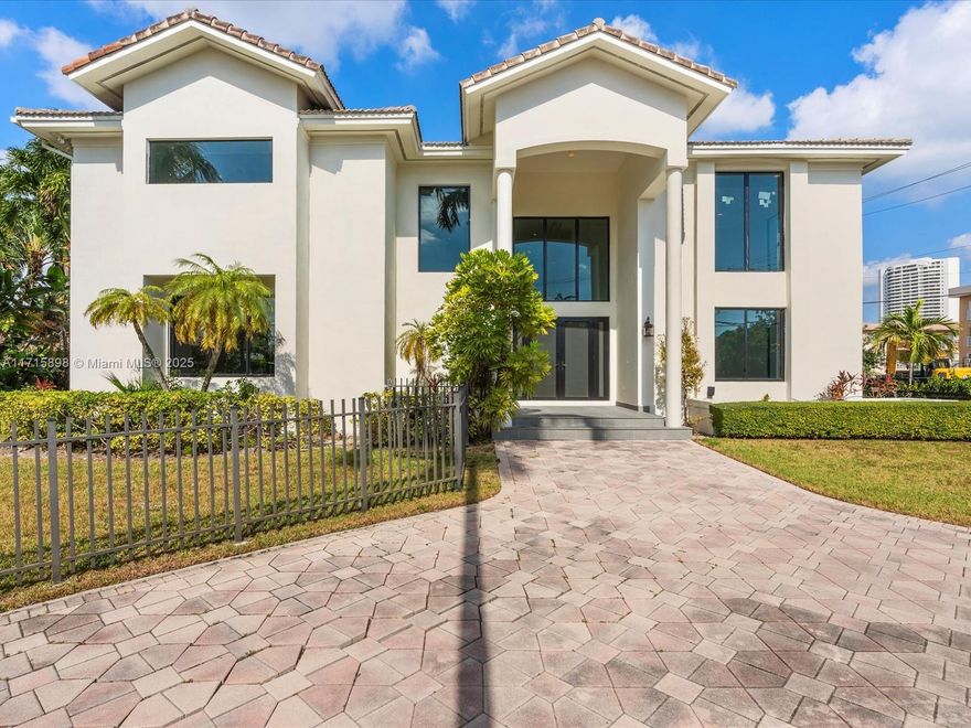 Indulge in the ultimate waterfront sanctuary, set within the prestigious Eastern Shores enclave. This recently renovated estate spans over 5,000 sq ft of refined living space on a vast 13,565 sq ft lot, offering unrivaled elegance, privacy, and 30 ft of prime water frontage.  Enter through a grand foyer with soaring ceilings and expansive floor-to-ceiling windows, seamlessly merging indoor and outdoor living. With five lavish en-suite bedrooms, including a primary suite with a private balcony, dual walk-in closets, and a spa-inspired bath, every detail exudes sophistication. The outdoor oasis features a summer kitchen, pool, hot tub, and private dock offering direct ocean access. Just moments from pristine beaches, world-class dining, and luxury shopping. Schedule a private tour today!
