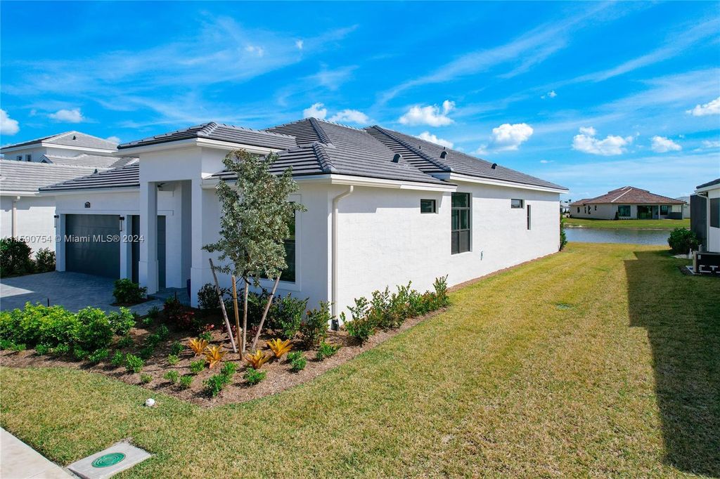 Photo of 9157 SW SW Arco Way, Port Saint Lucie, FL 34987 (MLS # A11590754)