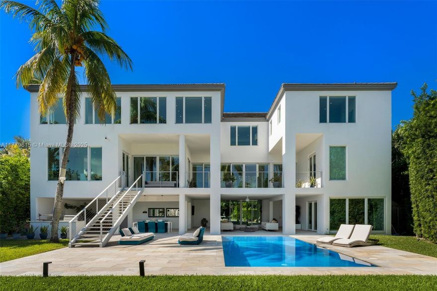 Discover perfection on coveted Mashta Island...this fully remodeled waterfront estate offers seamless, direct ocean access and mesmerizing views of Smugglers Cove and Biscayne Bay. Designed for ultimate indoor-outdoor living, this 3-level modern and elegant masterpiece features 8,544 SF total of actual area which includes garage and terraces and sits on a 17,012 SF lot with sun-filled contemporary spaces, top finishes, natural light throughout and exceptional craftsmanship. Featuring 5 bedrooms + office which can easily be converted to a 6th bedroom, 6.5 baths, elevator, garage, gym + extra parking, private dock ideal for boaters, summer kitchen, resort-style pool, and a spectacular covered entertainment level... this home is your own private waterfront resort in paradise.