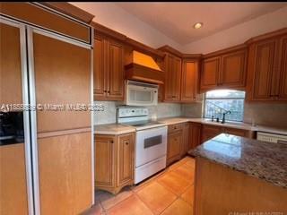 Beautifully maintained 2-bedroom, 2-bath condo located in the desirable Emerald Isles West community in Davie. This spacious second-floor unit offers an open split-bedroom floor plan, tile flooring and carpeting throughout, and abundant natural light. Enjoy a private wrap-around balcony with peaceful garden views, perfect for morning coffee or evening relaxation. The kitchen features ample cabinet space and a breakfast bar, with in-unit laundry for convenience. All-ages community with well-kept common areas, clubhouse, pool, and more. Centrally located near Nova Southeastern University, shopping, dining, major highways, and parks.