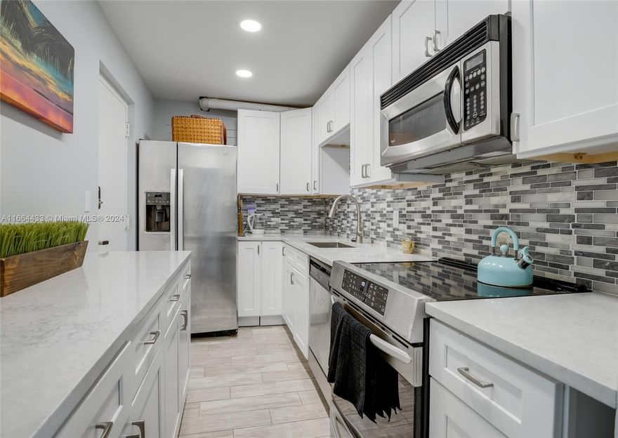 Tucked away in a quiet friendly sort after West Palm Beach neighborhood, Gorgeous 2-bedroom 2 bathroom beautifully renovated condo with an amazing view is being offered FULLY FURNISHED. Open floorplan welcomes natural sunlight into every room.  Kitchen boasts ample storage Crisp white cabinetry, Granite countertops and Stainless-Steel Appliances!!! Coastal style title flooring throughout looks like wood plank, Pet friendly. Laundry facilities conveniently located on each floor. A/c unit 2 yrs. old. Enjoy the tranquil views, Florida life the Balcony. Walking distance to West Palm Beach Outlets with bars, restaurants & shopping, worship, Nearby downtown, beach, Cityplace, Clematis Street. Easy access to major highways, airport.   Don't miss your opportunity to secure this home for yourself.