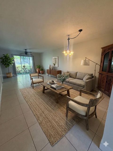 Photo of 5080 SW 64th Ave #104, Davie, FL 33314 (MLS # A12011525)