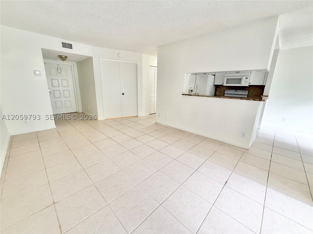 Photo of 9755 Westview Dr #1217, Coral Springs, FL 33076 (MLS # A12059793)