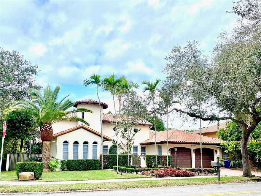Stunning Spanish-style home in the sought-after Royal Oaks community of Miami Lakes. This bright and spacious residence features sun-filled living and dining areas with French doors opening to a private pool patio, perfect for entertaining. The chef-inspired kitchen offers ample cabinetry and a cozy breakfast nook. A unique upstairs loft provides the ideal space for a home office or reading lounge. The primary suite includes a walk-in closet and private ensuite bath, while two additional bedrooms share a full hallway bath. The beautifully landscaped, fully fenced corner lot offers privacy and tranquility. Just minutes to shopping, dining, parks, and top-rated schools, with easy access to Hollywood Beach and major highways.