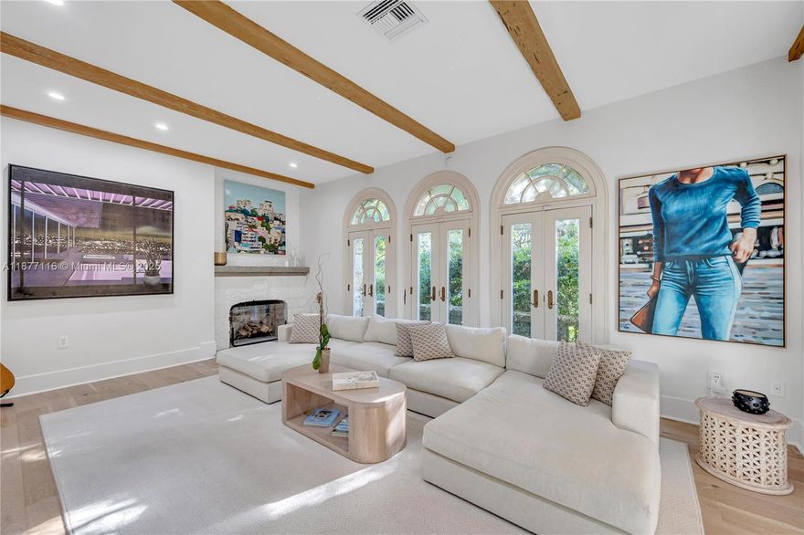 Fall in love w/"Casa Roca" one of 27 Coral Rock homes designed by H. George Fink in our City Beautiful. Appointed on the most prestigious tree canopied street, surrounded by fellow historic & iconic architecture. While preserving the romance & enchantment of the 1920's minimalism, this home has been re-introduced to modern luxury. Greeted by a captivating Spanish Loggia entrance, soaring ceilings, exposed wood beams, natural oak floors throughout living spaces & gorgeous Porcelanosa tile in fully remastered chef inspired kitchen. Cozy up by fireplace where abundance of natural light pours in. Bathrooms have been redesigned providing seamless marriage of traditional & modern. Over $1mm + in renovations. Brand new impact windows.