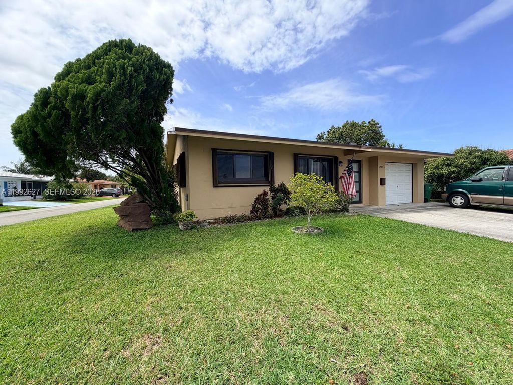 Photo of 4900 NW 53rd Ct, Tamarac, FL 33319 (MLS # A11992627)