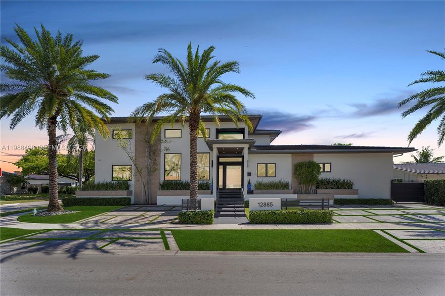 Experience luxury Miami waterfront living in this meticulously custom built 4,772 SF residence in the prestigious guard-gated community of Keystone Point. Situated on an oversized 100’ x 125’ corner lot, this exceptional home offers 100' feet of deep-water frontage with direct ocean access and no bridges to bay.  4 bedrooms and 5 designer bathrooms, this home showcases high-end finishes, a grand hurricane-impact pivot entry door, custom solid wood doors, and seamless indoor-outdoor living. The gourmet kitchen boasts natural gas cooking with premium Sub-Zero and Wolf appliances, plus a wet bar with dual beverage dispensers and ice machine. A full smart home system includes integrated audio/video, multi-zone sound, lighting automation, security, cameras, Wi-Fi, pool automation, and more, enhanced by a Bowers & Wilkins and JL Audio system. Additional features include impact windows/doors, copper plumbing, dual recirculating water heaters, an oversized air-conditioned garage (lift-ready), and parking for 11 cars. The corner lot allows easy side access to the garage and dock. Enjoy a private waterfront oasis with a 20K lb boat lift, dock, gazebo with summer kitchen, and lush landscaping. Ideally located just minutes from Bal Harbour, Bay Harbor Islands, and the area’s renowned beaches, this exceptional home offers the perfect combination of luxury, privacy, and convenience.