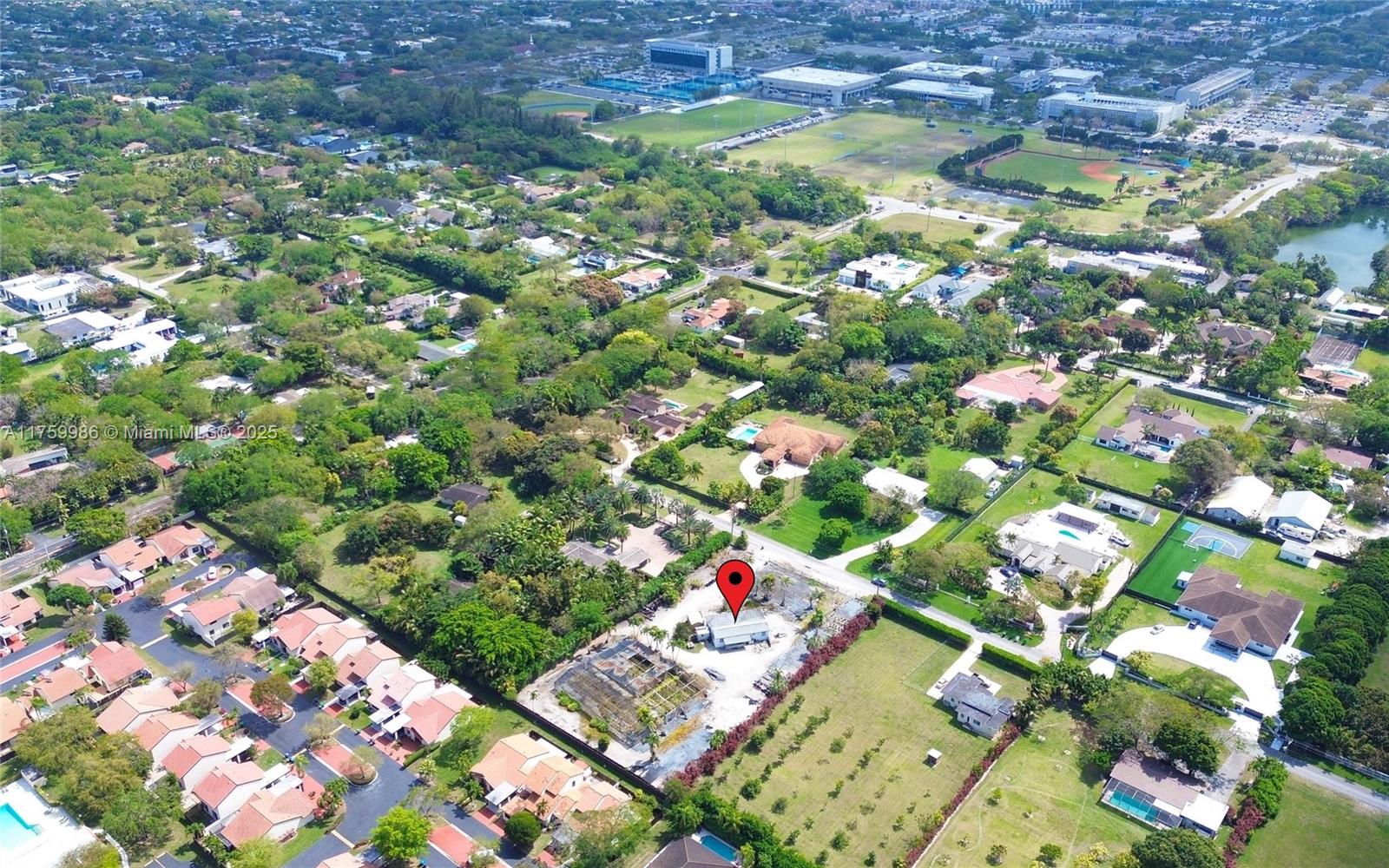 Experience the unparalleled beauty of owning a vast 50,965 SF sanctuary in Kendall, Miami—your ultimate opportunity to craft a one-of-a-kind estate in The Magic City, where expansive land is the true luxury within itself. Perfectly situated, minutes from major highways, MIA, offering daily flights to over 185 destinations worldwide, premier shopping destinations, diverse dining options, and top-rated hospitals and schools, this blank canvas awaits the realization of your dream home and includes a charming 2-bedroom, 1-bathroom home with a den, offering immediate living space or a rental opportunity while building your custom home. Custom-built estates in this area range from $4 to $6 million, making this a once-in-a-lifetime investment opportunity to bring your vision to life.