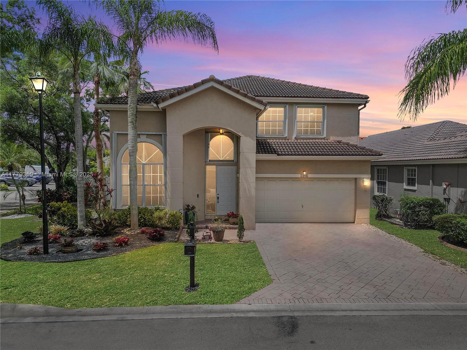 Lovely 2-story corner-lot home in the gated community of Lennox Isle. Overlooking a beautiful park, with volume ceilings & an open-concept layout filled with natural light. BRAND NEW ROOF -2025! Updated bathrooms. The spacious living room flows effortlessly into a kitchen equipped with rich cabinetry & views of the lush backyard oasis. A downstairs bedroom & full bath offer added convenience. Upstairs, retreat to the serene primary suite with double walk-in closets & a spa-like en suite bath. Enjoy tropical landscaping, an extended patio, & a fenced yard perfect for entertaining. Located in a gated community on Lake Coral Springs with access to the pool, pickleball, tennis & more. Has a generator & is hurricane-ready with accordion shutters. Free 1-year home warranty! An absolute Must-See!