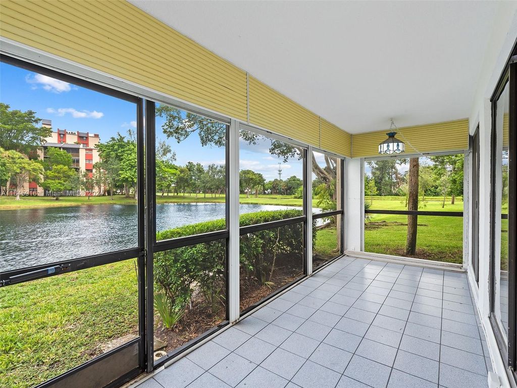 Photo of 2310 S Cypress Bend Dr #104, Pompano Beach, FL 33069 (MLS # A11645916)