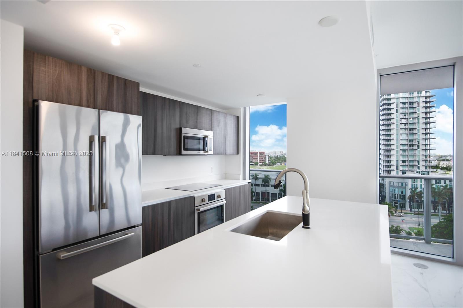 Corner 3 bedroom 3 bathroom unit with wrap-around terrace at Aria on the Bay! Open city and sunset views. The elegant and modern design of this unit is highlighted by the beautiful Italkraft kitchen, complete with white quartz countertops and top-of-the-line appliances. Spacious living area and high ceilings. One assigned parking space on third space (L313). This full-service building offers an array of amenities to cater to your every need, including valet parking, concierge services, a fully equipped gym, party room, movie theater, business center, kids play room, and more. Located in the vibrant Edgewater neighborhood, this property is walking distance to parks, restaurants, and supermarkets, offering the ultimate in convenience.