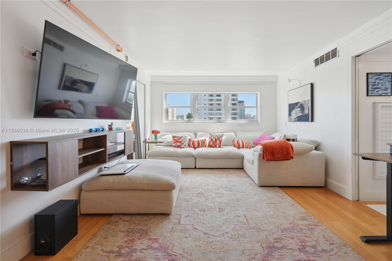 Beautifully renovated and fully furnished 2 bedroom 2 bath just steps to Lincoln road & beach. Large open living area/dining room with open kitchen/ bar height counter.. great for entertaining. Building has 24hr front desk valet Pool and gym Gated parking in attached lot. e. Impact resistant windows, newer washer/dryer, newer a/c, fully upgraded guest suite with custom buildout storage and pull down murphy bed, 2 smart tvs, 65/55 in, large walk in closet in master, upgraded custom bathrooms, premium cloud couch in living room. Stellar location minutes from the beach and all the hot spots that South Beach have to offer.