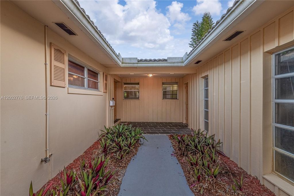 Photo of 225 Gleneagles Dr, Atlantis, FL 33462 (MLS # A12002776)