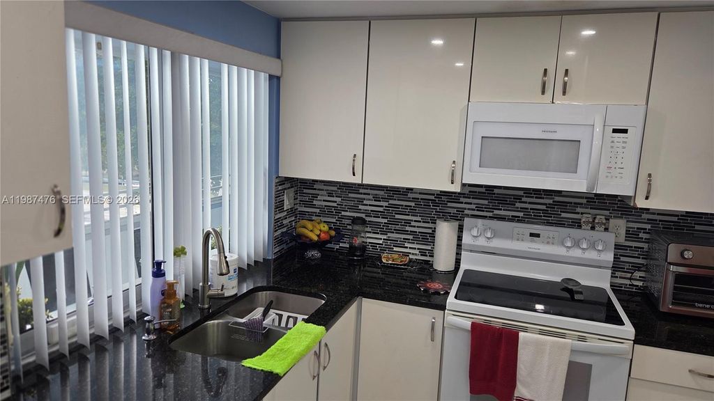 Photo of 9400 Lime Bay Blvd #315, Tamarac, FL 33321 (MLS # A11987476)