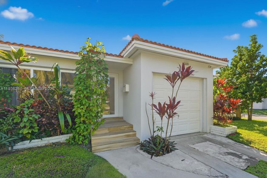 Well-located east of US-1, this move-in ready 2-bedroom, 1-bath residence sits on an oversized 8,723 SF corner lot just minutes from Downtown Hollywood, the beach, and the Broadwalk. Recent improvements include a new roof and central A/C (2025), updated flooring, and a spacious kitchen with stainless steel appliances. The bathroom features double sinks and tile finishes. Bright interiors offer excellent natural light throughout. Fully fenced yard provides privacy with ample space for outdoor entertaining, future pool, or expansion. Additional features include impact garage door, private driveway with parking for multiple vehicles, fruit trees, and no HOA. Convenient access to schools, shopping, dining, and major roadways. Vacant and easy to show.