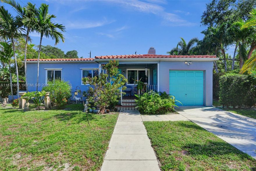 Located in the highly desirable Northeast Miami Shores neighborhood, this authentic 1938 gem beautifully blends timeless character with modern updates. Featuring a split floor plan for enhanced privacy and functionality, this 3-bedroom, 2-bathroom home sits on a generously sized 1.5-lot property—offering ample space to expand, add a pool, or simply enjoy the open yard. Move-in ready, the home boasts original wood floors, impact windows throughout, and a working fireplace adorned with a charming ship engraving, adding warmth and historic charm to the living space. The recently remodeled kitchen and bathrooms complement the home's classic appeal with tasteful touches. A fully fenced yard with fruit trees offers privacy and endless potential for outdoor living.
