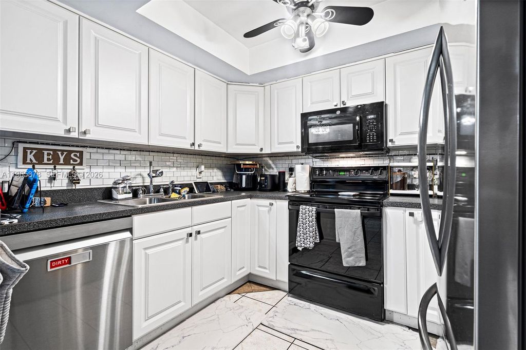 Photo of 6131 Seven Springs Blvd, Green Acres, FL 33463 (MLS # A11965878)