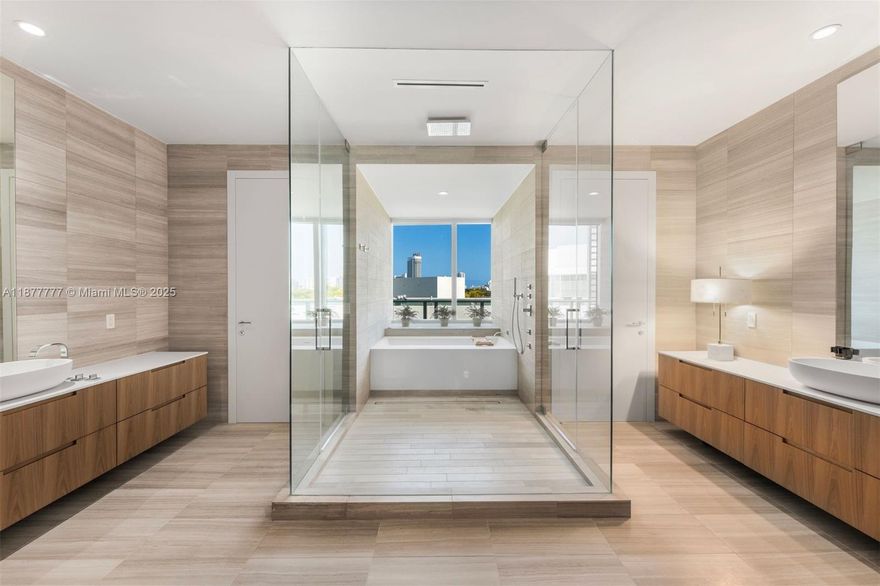 Welcome to an exceptionally rare 4bd, 4.5ba corner unit spanning 4,204 sq ft of refined indoor living. With a private elevator entrance, multiple entertaining areas, and a large media room, this residence feels like a private home. Breathtaking views of the Miami skyline through floor-to-ceiling windows, the expansive layout is ideal for both relaxed living and elevated entertaining. A sleek Boffi kitchen with Gaggenau appliances anchors the open living space, while custom millwork and clean architectural lines echo minimalist design. Oversized primary suite includes spa-inspired bath, 2 walk-in closets, private balcony. Enjoy 5-star Ritz-Carlton amenities with 24-hr concierge and valet service. This serene enclave just minutes from the beach, Sunset Harbour, and Bal Harbour.