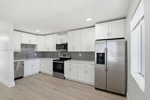 Photo of 1400 NE 43rd Ct, Pompano Beach, FL 33064 (MLS # A11957158)