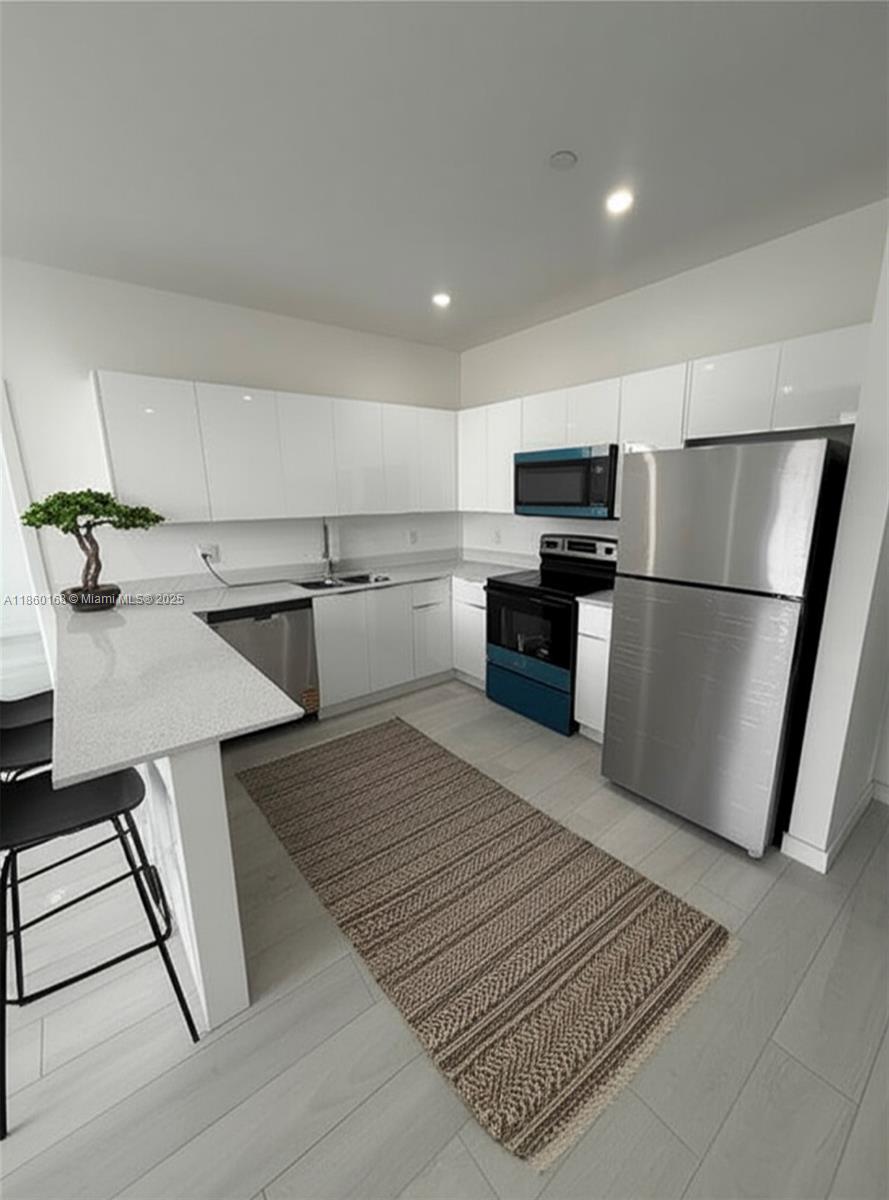Be the first one to live in this brand new 2-bedroom 2-bathroom apartment located in Hialeah! Promotion: $2,600 per month with the first month free on a 15-month lease. State of the Art Building with 12 brand-new 2-bedroom, 2-bathroom apartments ready to move in by the first week of June. Credit 620+: 1st month + 1 month security deposit. Credit 619 or less: 1st month + 2 months' security deposit. Each apartment features In-Unit Washer & Dryer, Stainless Steel Appliances, and Granite Countertops. Building is Pet-friendly and has a high-speed Elevator and secured code access lobby. Exciting New Urban Area with Metro Rail & Tri-Rail Stations one block away. Free Bus and Private Car Service within the City of Hialeah! Schedule your tour today! Text/call listing agent for showing.