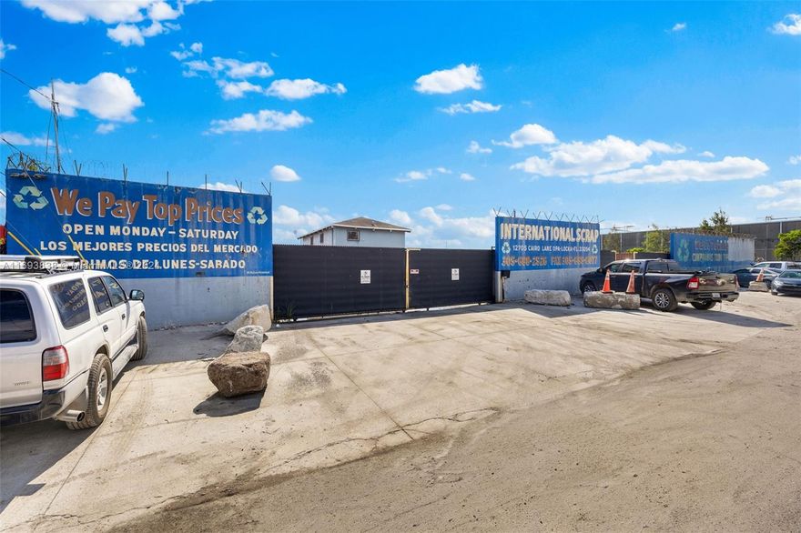 Rarely available 2.43 acre site in Opa-locka with Heavy Industrial zoning consisting of a 3500sf 2-story office and a detached 5000sf 5-bay warehouse. The site is fully-paved and gated along with security camera system. Lot provides easy access for trucks to access and was previously operating as a scrap metal yard so has two weigh stations in place. Zoning code is heavy industrial but can accommodate lighter uses like outside storage.
