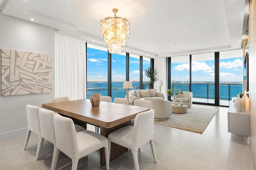 Welcome to your COMPLETELY REIMAGINED northeast corner residence at Aria Reserve South on the 32nd floor with forever unobstructed Biscayne Bay and ocean views from an expansive terrace. The only fully renovated residence of its kind in the building (all developer finishes have been changed), featuring brand-new custom imported flooring and a custom PEDINI chef’s kitchen with premium Thermador appliances and quartzite countertops, complemented by custom doors, millwork, motorized window treatments, wallpaper, and built-out closets throughout. Every detail considered, no expense spared. All bedrooms feature redesigned en-suite bathrooms, while the primary suite includes dual sinks and an oversized walk-in closet. The residence also includes a private elevator entry with foyer, service entrance with storage, and a den. Residents enjoy 2 acres of world-class amenities, including 3 pools, sauna, steam and massage rooms, fitness center, game room, children's room, conference center, putting green, and sport courts for tennis, basketball, and pickleball. Prime Edgewater location near Margaret Pace Park with easy access to Miami Beach and Downtown.