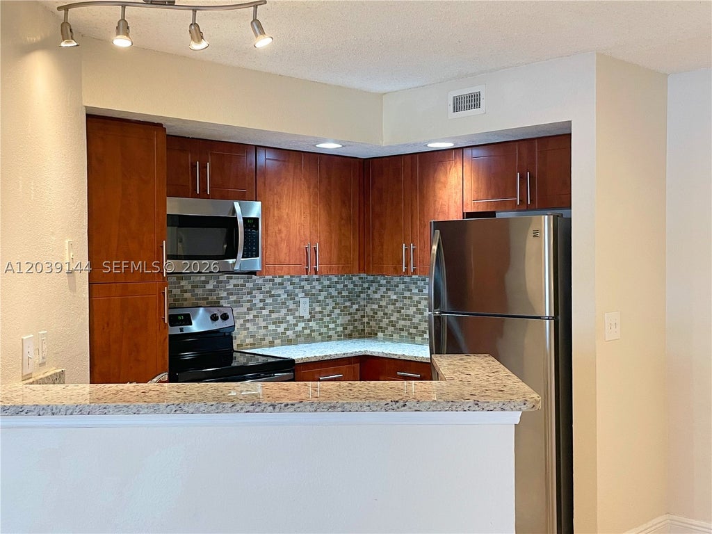 Photo of 12980 Vista Isles Dr #314, Sunrise, FL 33325 (MLS # A12039144)