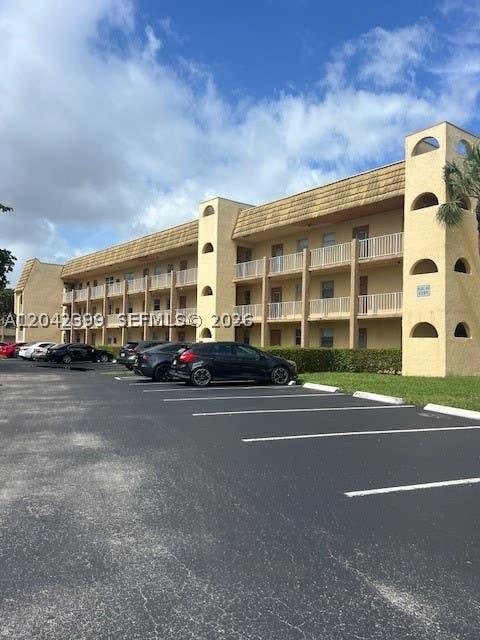 Photo of 8285 Sunrise Lakes Blvd #106, Sunrise, FL 33322 (MLS # A12042399)