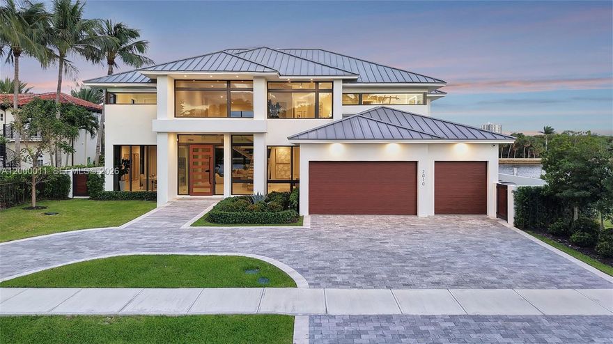 This waterfront residence in prestigious Coral Ridge delivers modern design, durability, and wellness-focused living, set on 85 feet of prime waterfrontage with unobstructed Intracoastal views. Built with concrete and steel construction, the home features soaring 22-foot ceilings that create a sense of openness and natural light throughout every living space. The residence includes a private elevator, a spa-inspired primary suite with steam shower, a first-floor office, temperature-controlled wine cellar, gas fireplace, and a Lutron smart home system seamlessly controlled via iPad. The gourmet kitchen is equipped with Wolf appliances, Sub-Zero refrigeration, and an underground 500-gallon propane system. Positioned along the Intracoastal in a no-wake zone with no fixed bridges, the property offers direct ocean access and uninterrupted water views from nearly every angle. As part of Glenn Wright’s H.A.L.O. wellness-focused residential collection, the home is designed to promote tranquility, comfort, and elevated living in one of Fort Lauderdale’s most exclusive and private enclaves.