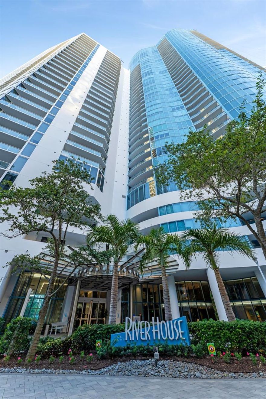 Turn-key luxury in the heart of the Venice of America. This 2-bed + entertainment ‘s bar, 3-bath residence at Las Olas River House offers over 2,100 sq ft of refined living with floor-to-ceiling glass showcasing sweeping views of the downtown skyline and situated along the New River . A secure fob-access elevator opens to a private foyer leading to a light-filled layout with designer lighting, premium flooring, a gourmet kitchen, an entertainer’s bar area and a completely renovated stunning master bathroom. Residents enjoy a resort-style lifestyle with a heated pool, cabanas, sauna, and a state-of-the-art fitness center overlooking the river. Huizenga Park is just downstairs with a dedicated dog run, perfect for pet lovers. Step outside to the Riverwalk and catch the Water Taxi to enjoy fine restaurants, cafés, and the Broward Center theater without ever needing a car. Concierge, valet, and LauderGO! shuttle service complete this exceptional riverfront living experience.