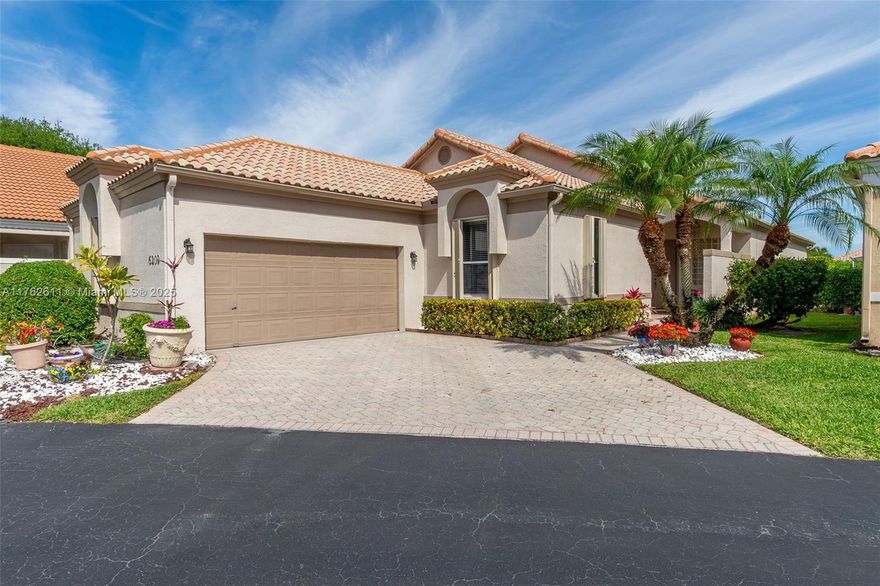 Beautiful one story home in gated golf course community, featuring an optional country club amenity,