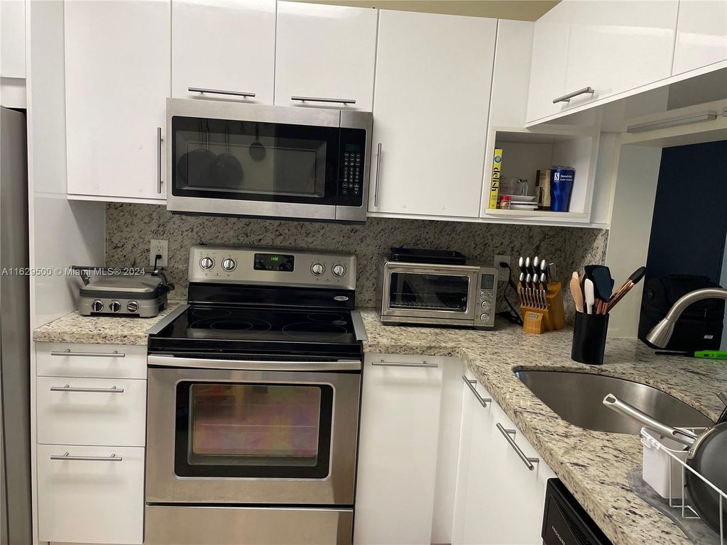 Photo of 10003 Winding Lake Rd #102, Sunrise, FL 33351 (MLS # A11629500)