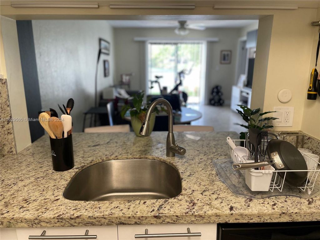 Photo of 10003 Winding Lake Rd #102, Sunrise, FL 33351 (MLS # A11629500)