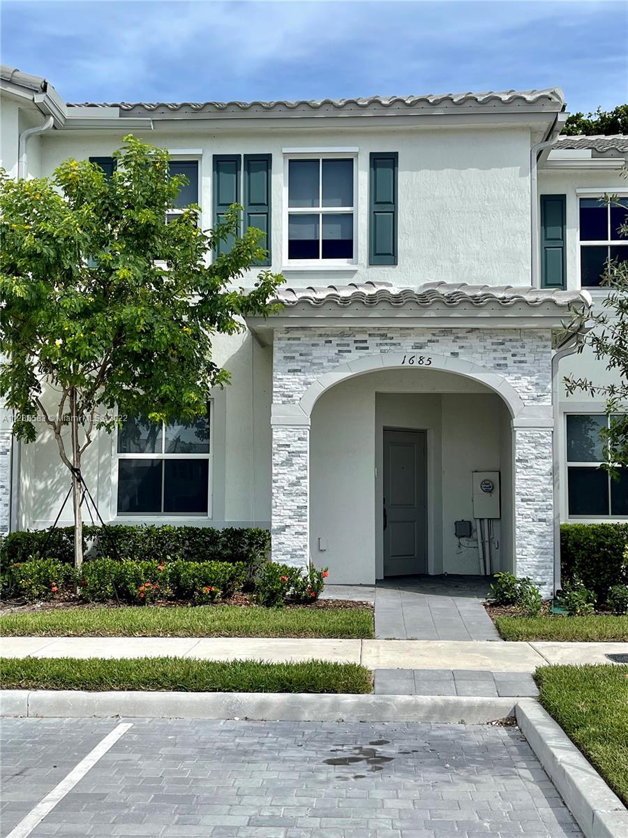 Amazing townhouse at The Riviera, a gated community with pool, gym and club house. This townhouse has 4 beds and 2 1/2 baths. There is one bedroom on the ground floors that can be used as a bedroom or as an office. Open concept kitchen with white quartz countertop, stainless steel appliances, nice back yard. Tile on the first floor and carpet on the second floor. There are three bedrooms and a washer and dryer on the second floor. The master bedroom is at the second floor. Enjoy this beautiful and modern home.