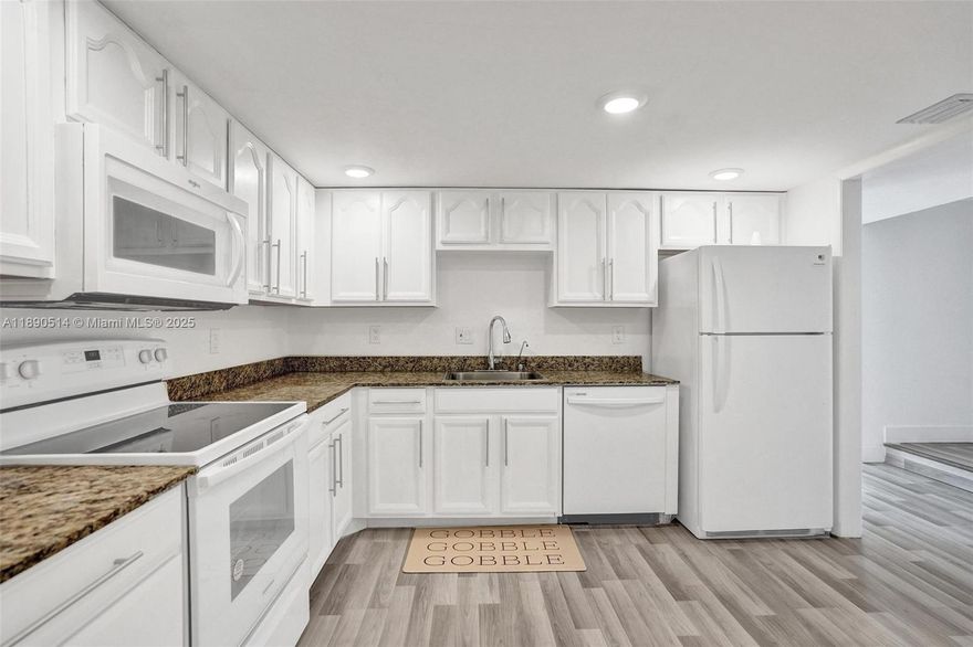 This home qualifies for up to $5000 in grants from JPMorgan Chase! Corner unit townhome in the gated community of Manors of Inverrary, featuring 3BD | 2.5BA This spacious home offers a front courtyard entry and has been refreshed with new wood flooring and fresh paint throughout creating a modern and welcoming feel. The updated kitchen boasts new appliances while the remodeled bathrooms and large walk-in closet with en-suite in the main bedroom add comfort and style. Enjoy multiple living spaces—formal living, dining, and family rooms—plus a covered and screened patio & balcony. Anew washer & dryer included. Extra storage and two parking spaces complete the home. **THIS HOME QUALIFIES FOR UP TO $7,500.00 IN LENDER CREDITS IF THE BUYER GETS APPROVED WITH OUR PREFERRED LENDER - SEE LISTING ATTACHMENTS**