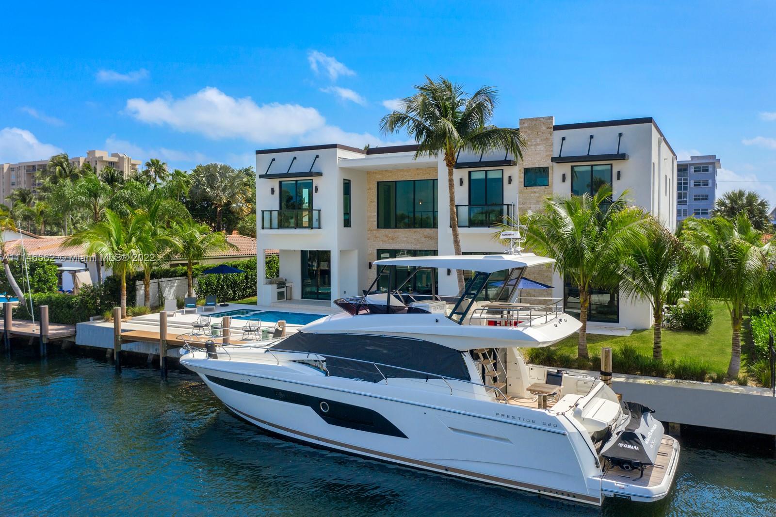 Located in exclusive coral ridge area, this Sophisticated Luxurious 2 story Modern Design buit in 2020 with 100 Ft. of deep water and no fixed bridges. State of the Art home fully equipped and closets. High impact energy efficient windows with protective film. Chefs Kitchen incl gas stove, SubZero, Steam &Electric oven. Heated infinity pool with spa, 2-car garage, 6 bedrooms, 6-1/2 baths.