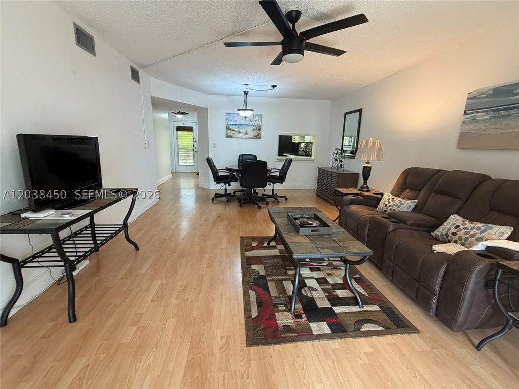 Photo of 4960 E Sabal Palm Blvd #308, Tamarac, FL 33319 (MLS # A12038450)