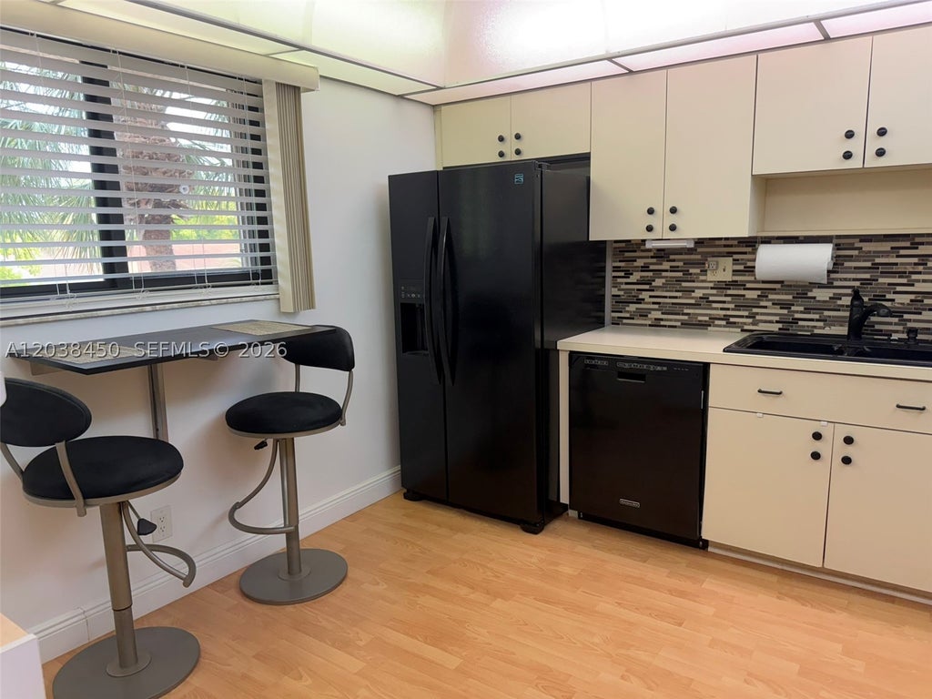 Photo of 4960 E Sabal Palm Blvd #308, Tamarac, FL 33319 (MLS # A12038450)