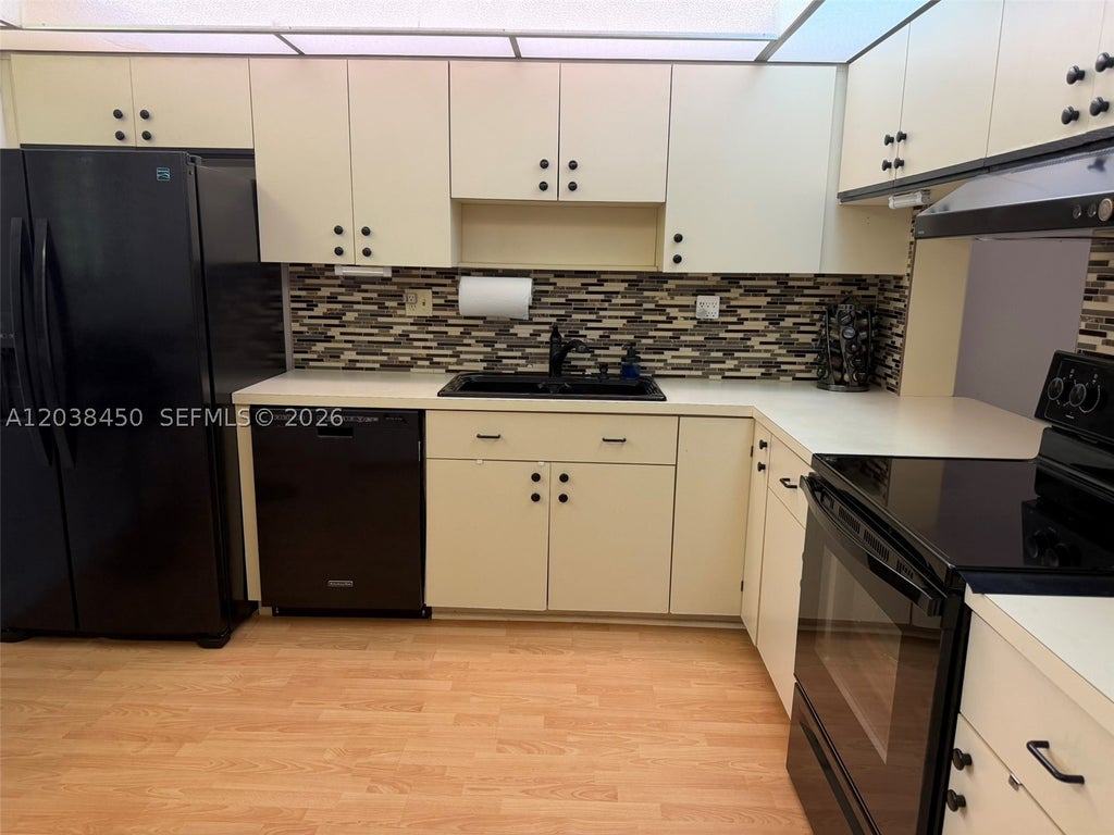 Photo of 4960 E Sabal Palm Blvd #308, Tamarac, FL 33319 (MLS # A12038450)
