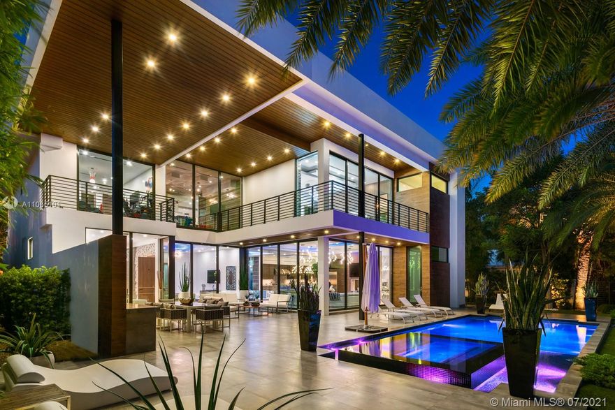 WOW!!! Feel the WOW Factor the minute you drive up to this spectacular home!!!! No expense spared!!!!! As you walk in, you are greeted by glass encased 3 car show garage, home office and gym. TOP quality modern finishes adorn this waterfront masterpiece!!! This jewel of a home features a gournment chef's kitchen with state of the art appliances, luxurious owner's suite with a spa bath, resort style pool with summer kitchen, exterior loggia and indoor elevator. All ensuite bedrooms! A large glassed in area upstairs could be a yoga studio, a playroom or an additional office. Dock your yacht on 90 feet of waterfront. A MUST SEE!