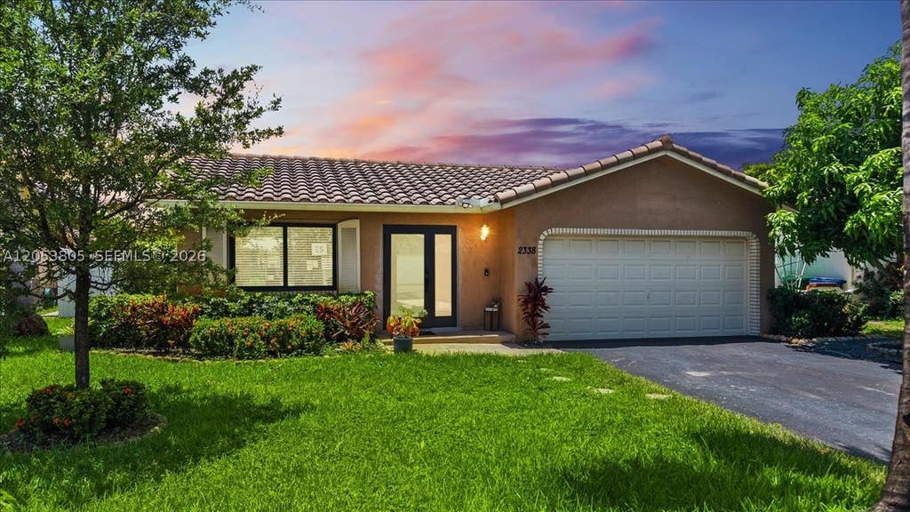 Photo of 2338 NW 98th Way, Coral Springs, FL 33065 (MLS # A12053805)