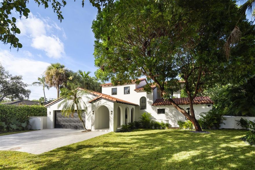 Modern Spanish Masterpiece. Total Transformation in Coral Gables. Meticulously rebuilt from the ground up, this residence is a complete brand-new construction. Situated on prestigious Riviera Drive in the coveted Golden Triangle, it blends timeless architecture with modern luxury. Sunlit interiors feature vaulted ceilings, wide-plank oak floors, and a custom oak kitchen with quartz counters, Miele appliances, and walk-in wine cellar. The primary suite offers dual walk-ins, fireplace, and spa bath. All bedrooms are en suite with built-ins. Smart-home features, impact windows, new 2-car garage. Private backyard oasis with pool, summer kitchen, and covered patio.