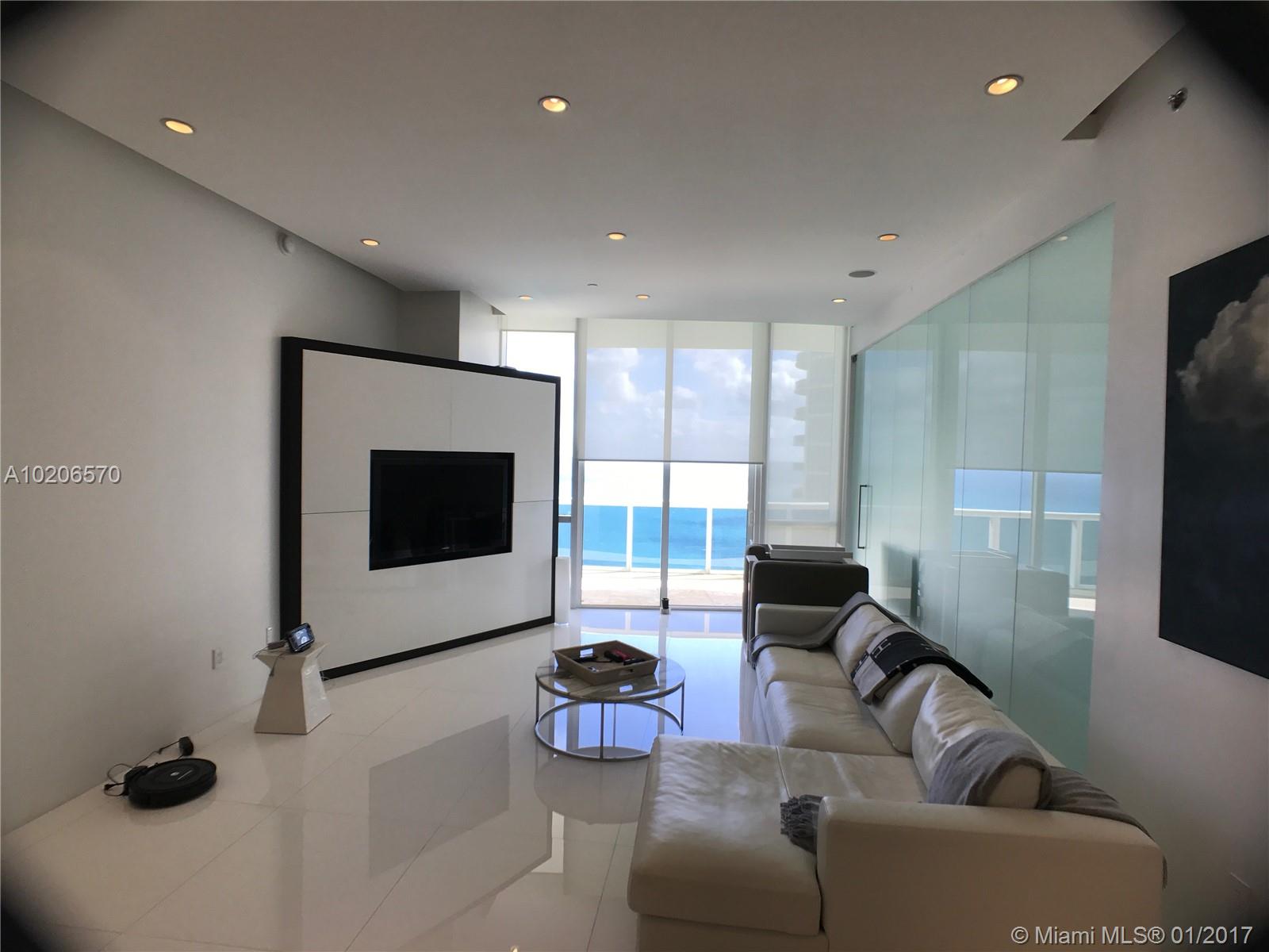 Unique modern architectural renovation, 11 FT ceilings w/private foyer; Floating ceilings concealed recessed lighting, cove LED lighting, speakers, electric shades. Custom cabinetry throughout in white lacquer & wenge. Frosted glass walls & doors, white glass quartz floors throughout. Upgraded Kitchen with Wolf appliances & 3 full baths feature custom quartz counters w/recessed sinks.